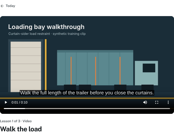 Learner lesson view with a synthetic loading bay training video and captions.